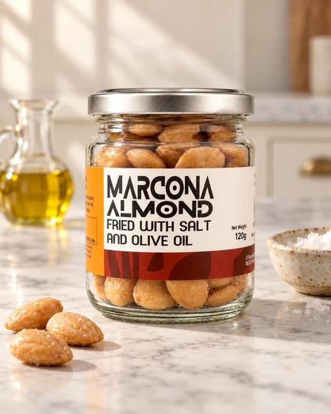Jar of fried Spanish Marcona almonds with salt and olive oil