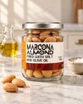 Jar of fried Spanish Marcona almonds with salt and olive oil