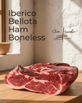 Iberico Bellota Ham — Boneless displayed on a wooden surface, showcasing its rich marbling and texture.