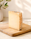 Manchego Semi-Cured Cheese Wedge from Casa Manolo, aged Spanish cheese prepared for serving and gifting