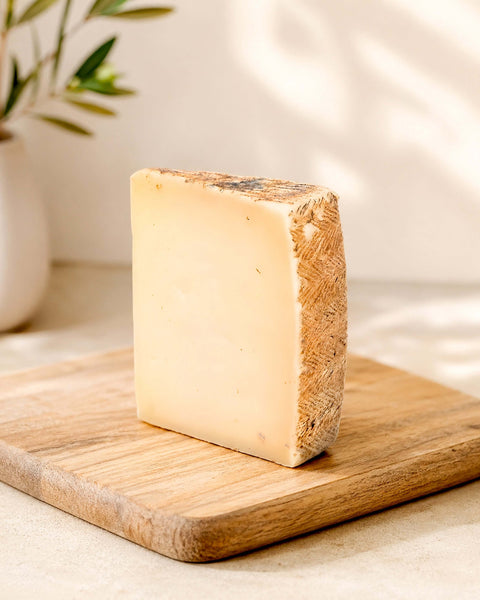 Manchego Semi-Cured Cheese Wedge from Casa Manolo, aged Spanish cheese prepared for serving and gifting